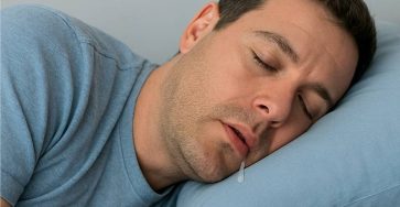 A man sleeping with his mouth slightly open